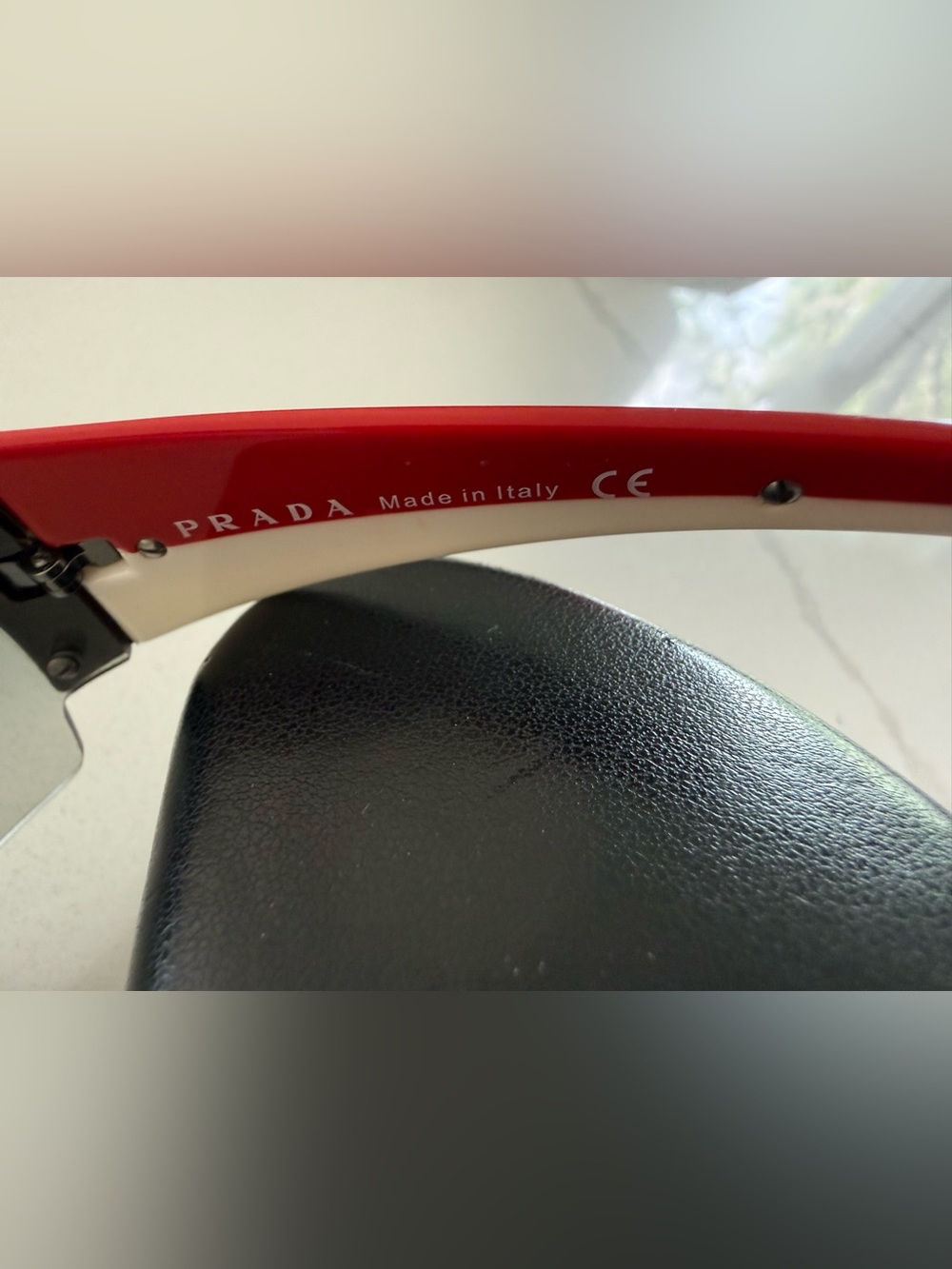 Prada Rimless Shield Sunglasses in Clear Gradient with Red/White stripe - Picture 4 of 11